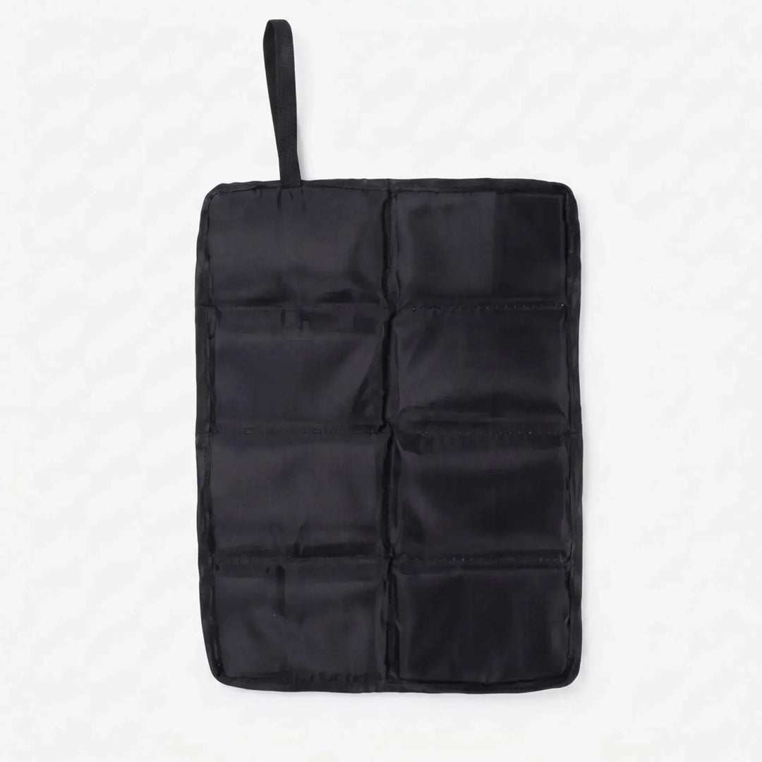 Compact black foldable outdoor seat pad. Perfect for camping, hiking, and sporting events. Portable cushion.