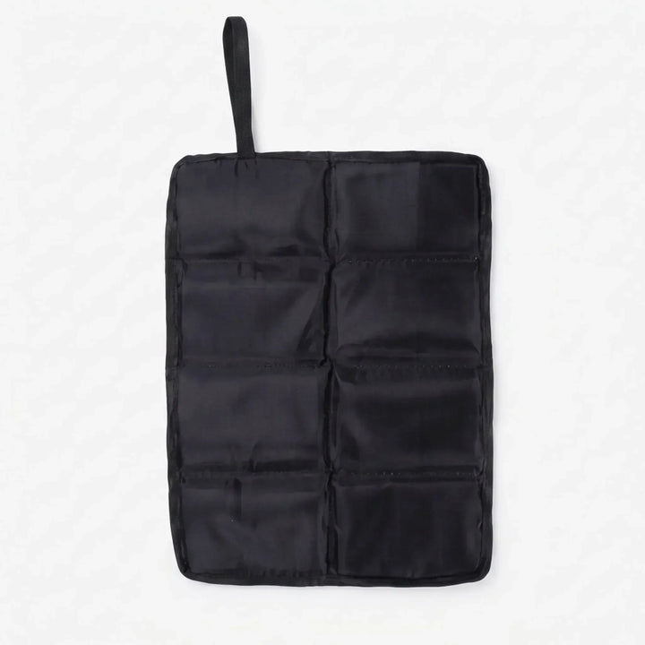 Compact black foldable outdoor seat pad. Perfect for camping, hiking, and sporting events. Portable cushion.