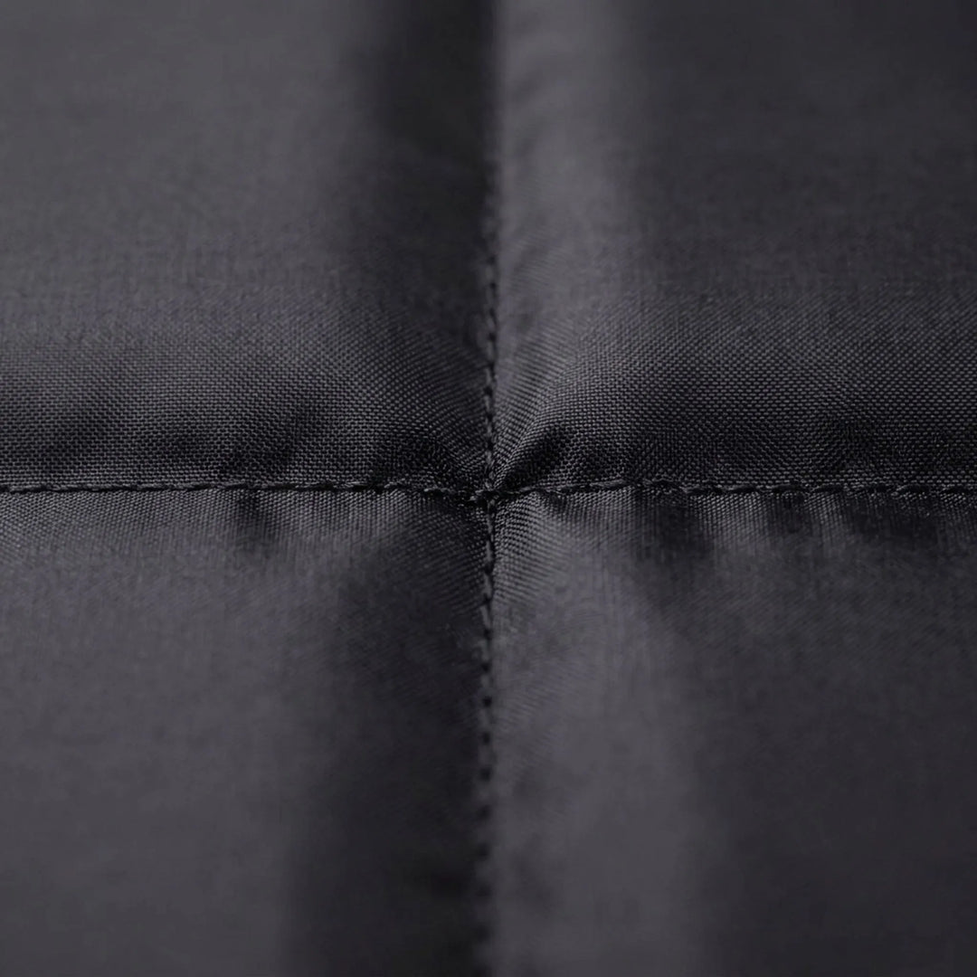 Folding camping seat pad. Black, portable & lightweight gear for hiking, fishing, and outdoor adventures.