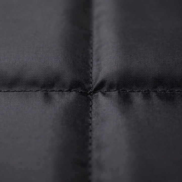 Folding camping seat pad. Black, portable & lightweight gear for hiking, fishing, and outdoor adventures.
