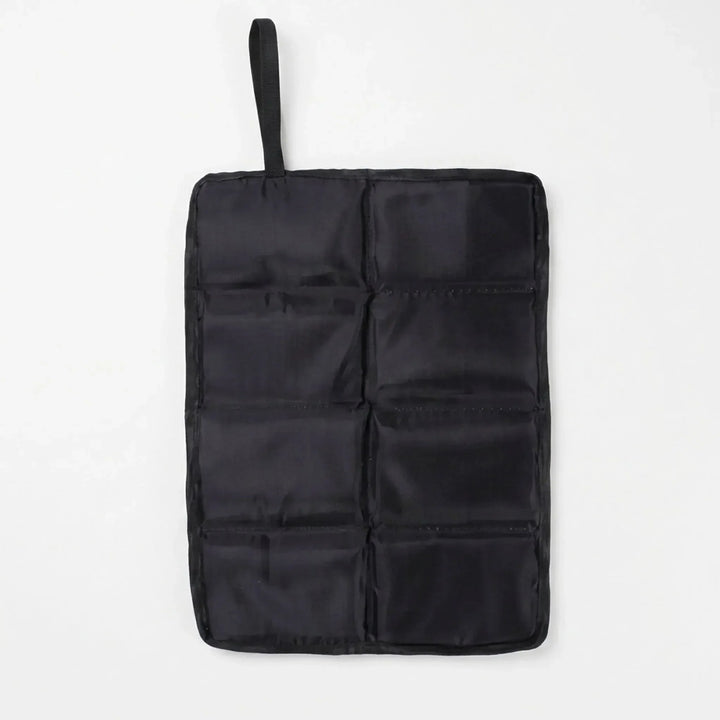 Durable black outdoor seat cushion. Foldable & portable for camping, hiking trips, and stadium seating.