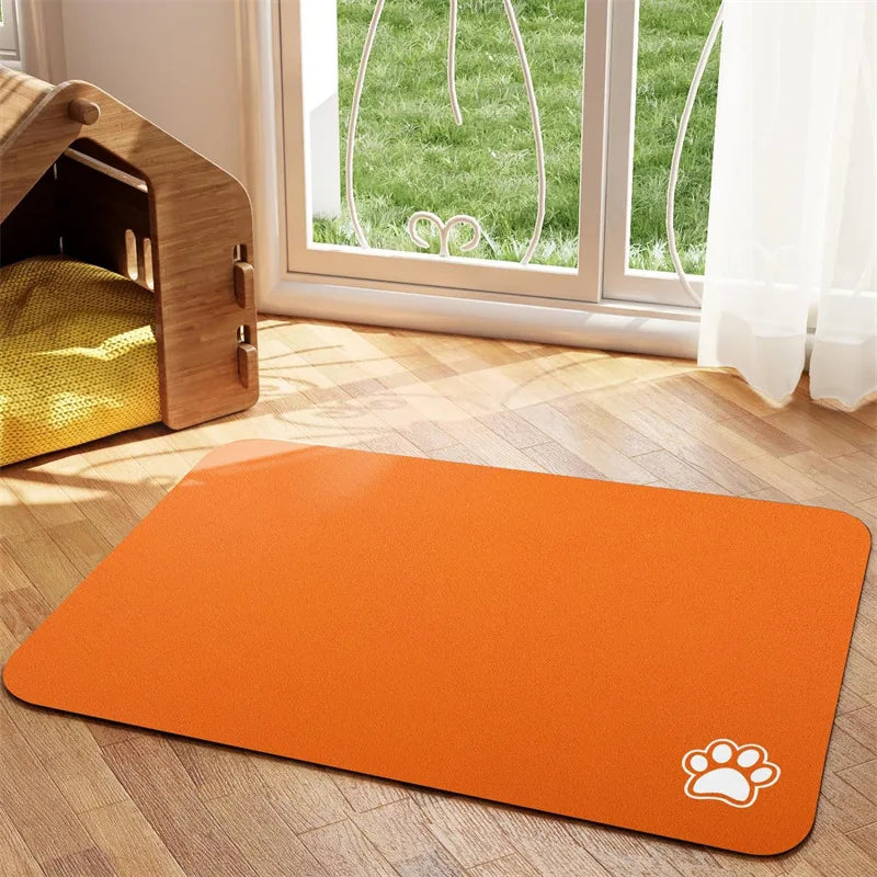 A set of pet food and water bowls sitting securely on a non-slip absorbent feeding mat