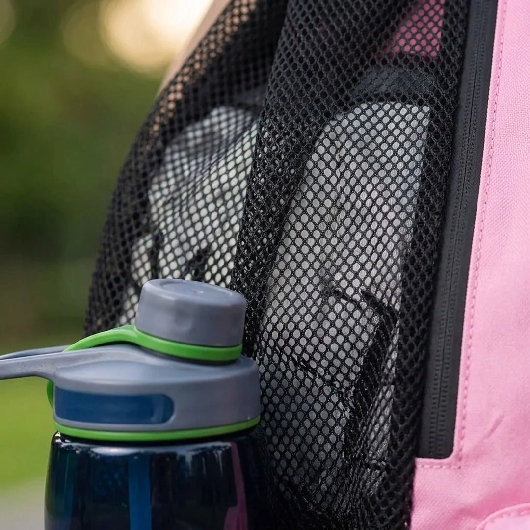 Unisex athlete carrying a black ventilated drawstring sports backpack, great for gym, travel & activewear.