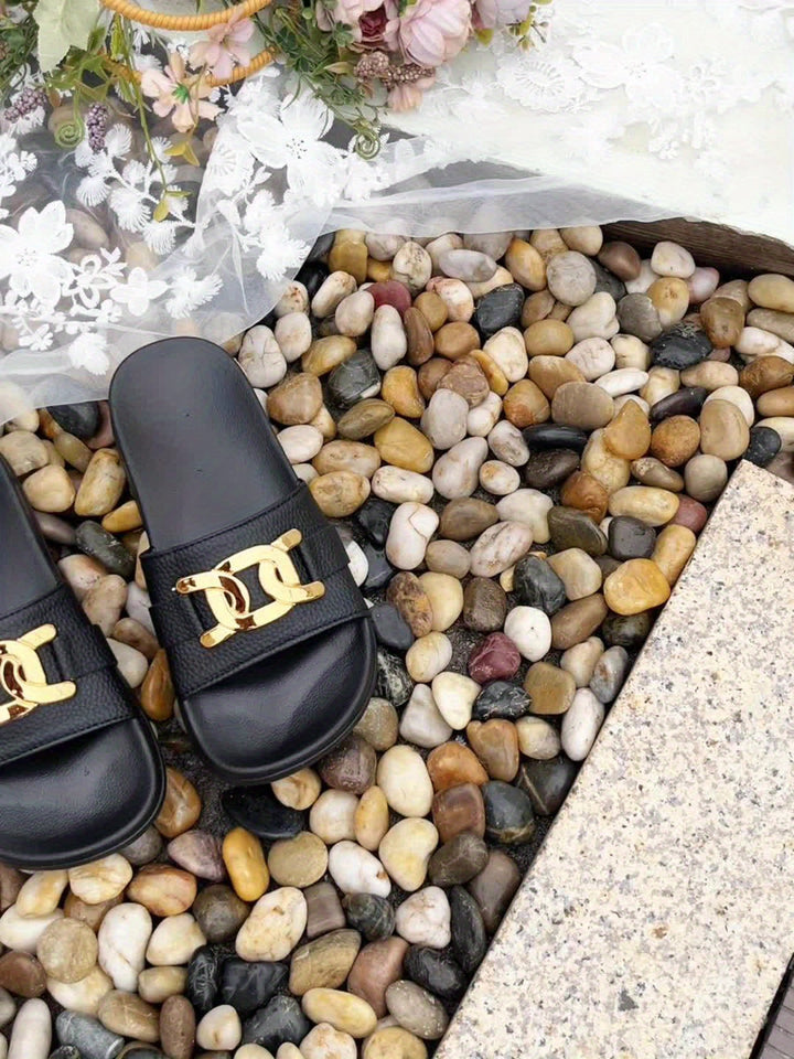 Essential black open-toe women's sandals, providing comfortable and stylish casual footwear for summer.