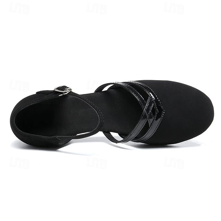 Women's black dance shoes, elegant footwear with ankle strap, round toe, & stable heel for graceful performance.