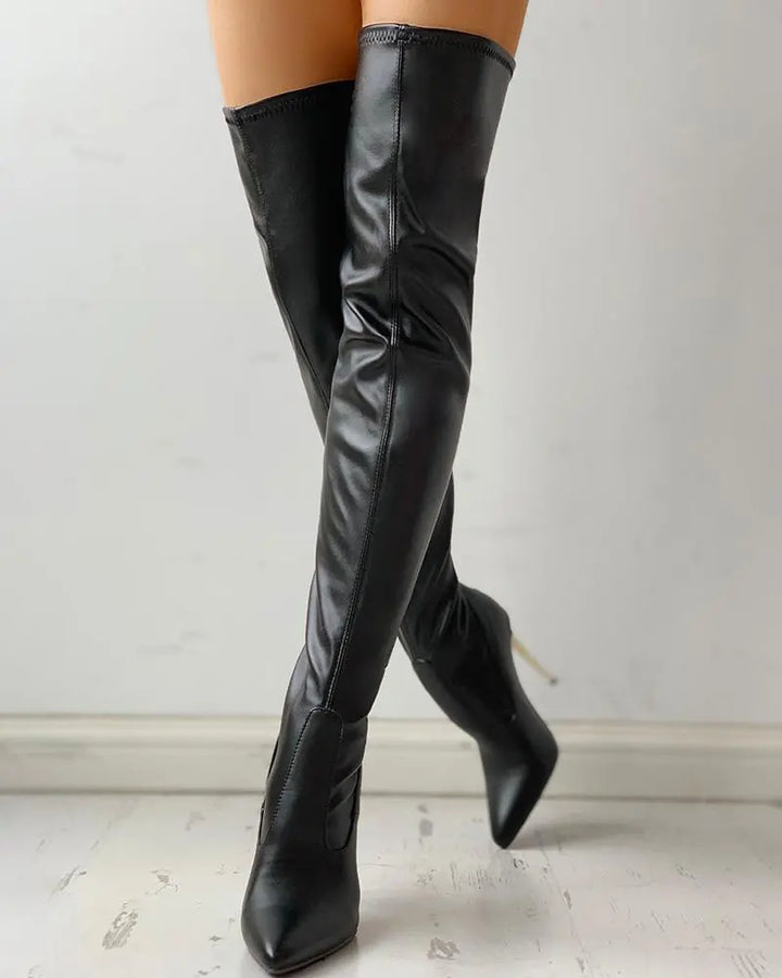 Black women's knee-high boots with zip-up and comfortable low heel for a classic, elegant, and versatile look.