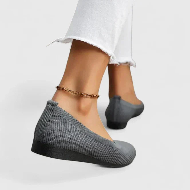 Lifestyle shot: Women's orthopedic slip-on shoes on a path, emphasizing comfort, arch support, and posture for walking.