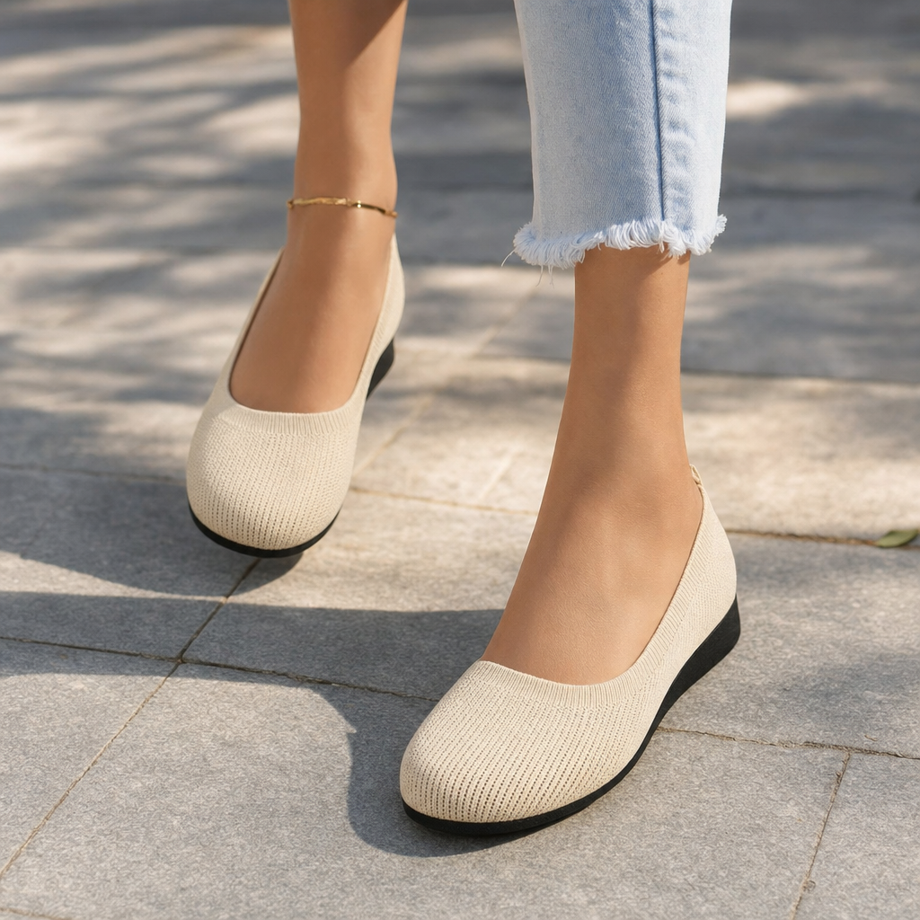 Front view of women's black orthopedic slip-on shoes, designed for ultimate walking comfort & posture support.
