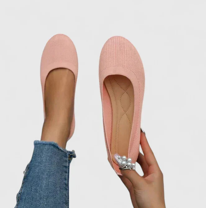 Durable, non-slip sole of women's orthopedic slip-on shoes, providing stable comfort & arch support for walking.