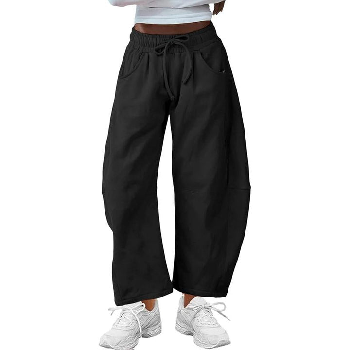 Elegant women's barrel-leg pants in a relaxed fit, perfect for chic, modern everyday wear.