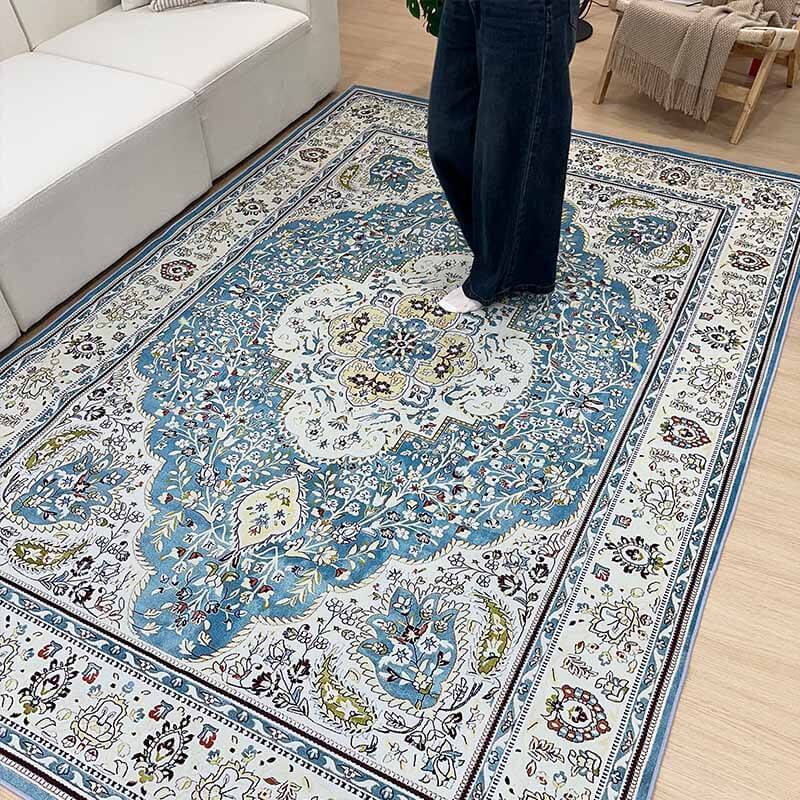 Polypropylene bohemian floral rug, pet-friendly and durable, accentuating a cozy bedroom space.