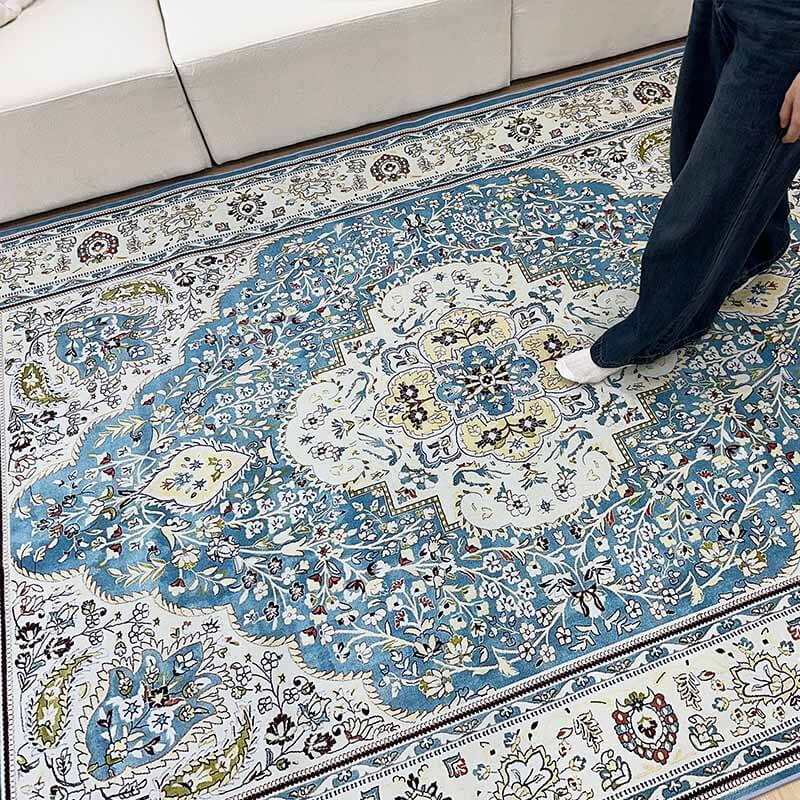 Bohemian style floral rug with abstract leaf and flower motifs, perfect for a cozy living room floor.