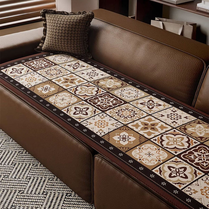 Bohemian ice silk breathable sofa cover draped over a couch, showcasing its unique design.