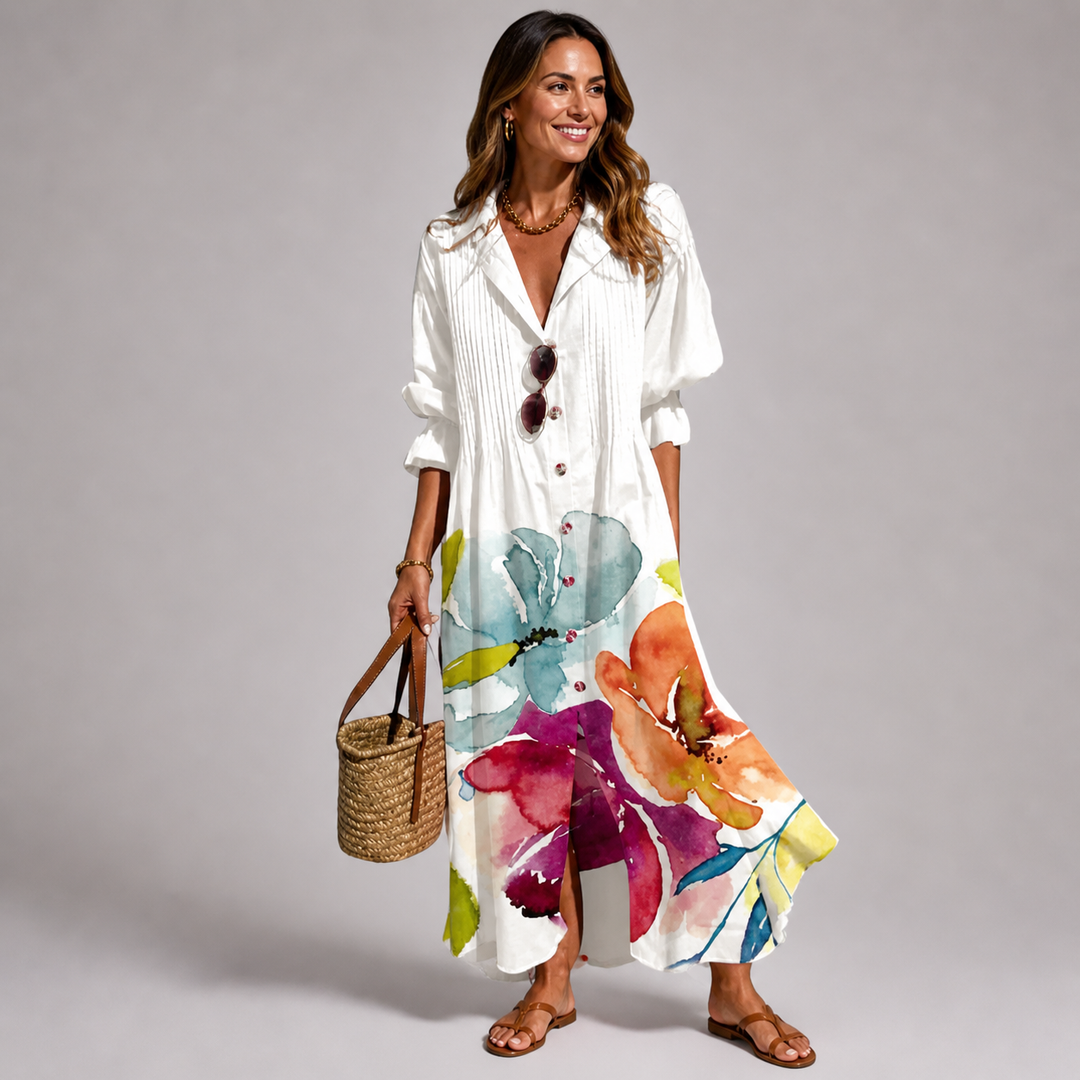Women's bohemian long sleeve V-neck maxi dress, featuring a striking print and functional button-front detail.