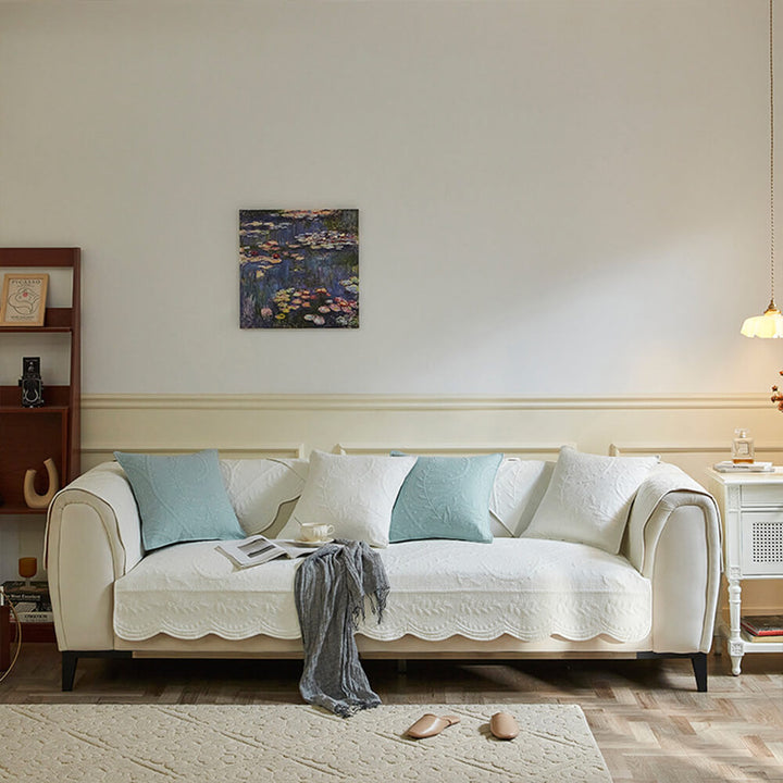 Living room couch featuring a durable, textured cotton boho slipcover in a neutral farmhouse aesthetic.
