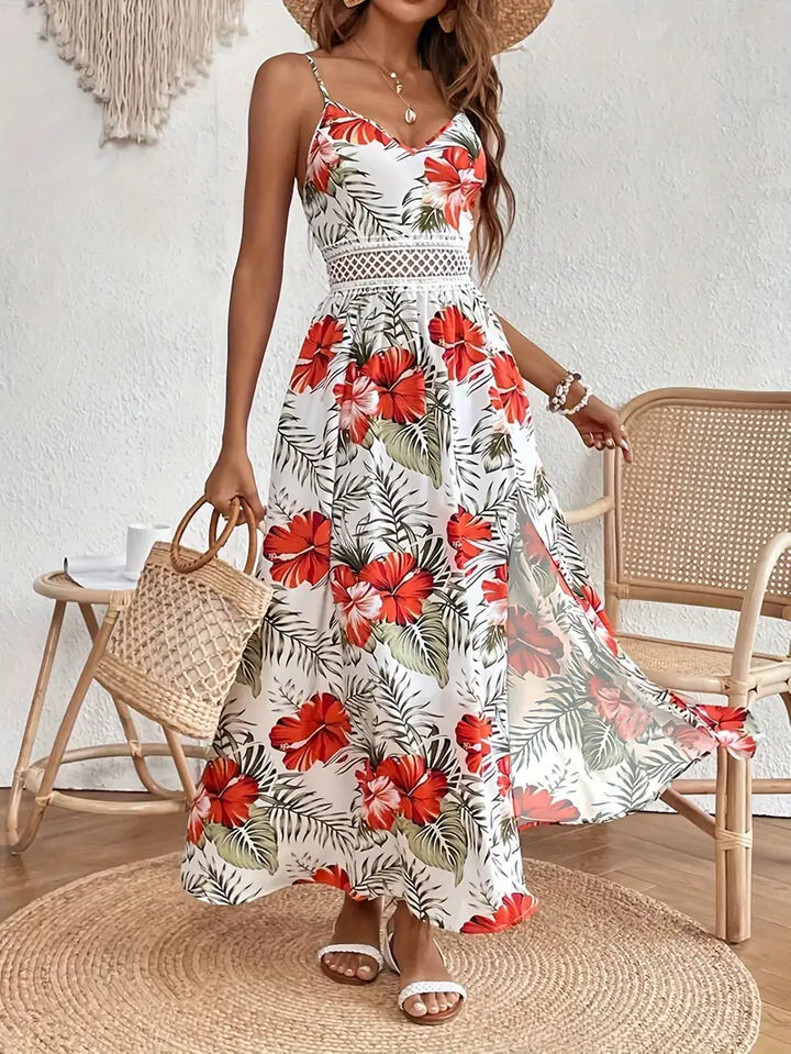 Sleeveless A-line boho maxi dress featuring a vibrant tropical palm print & delicate crochet V-neck for wedding guests.