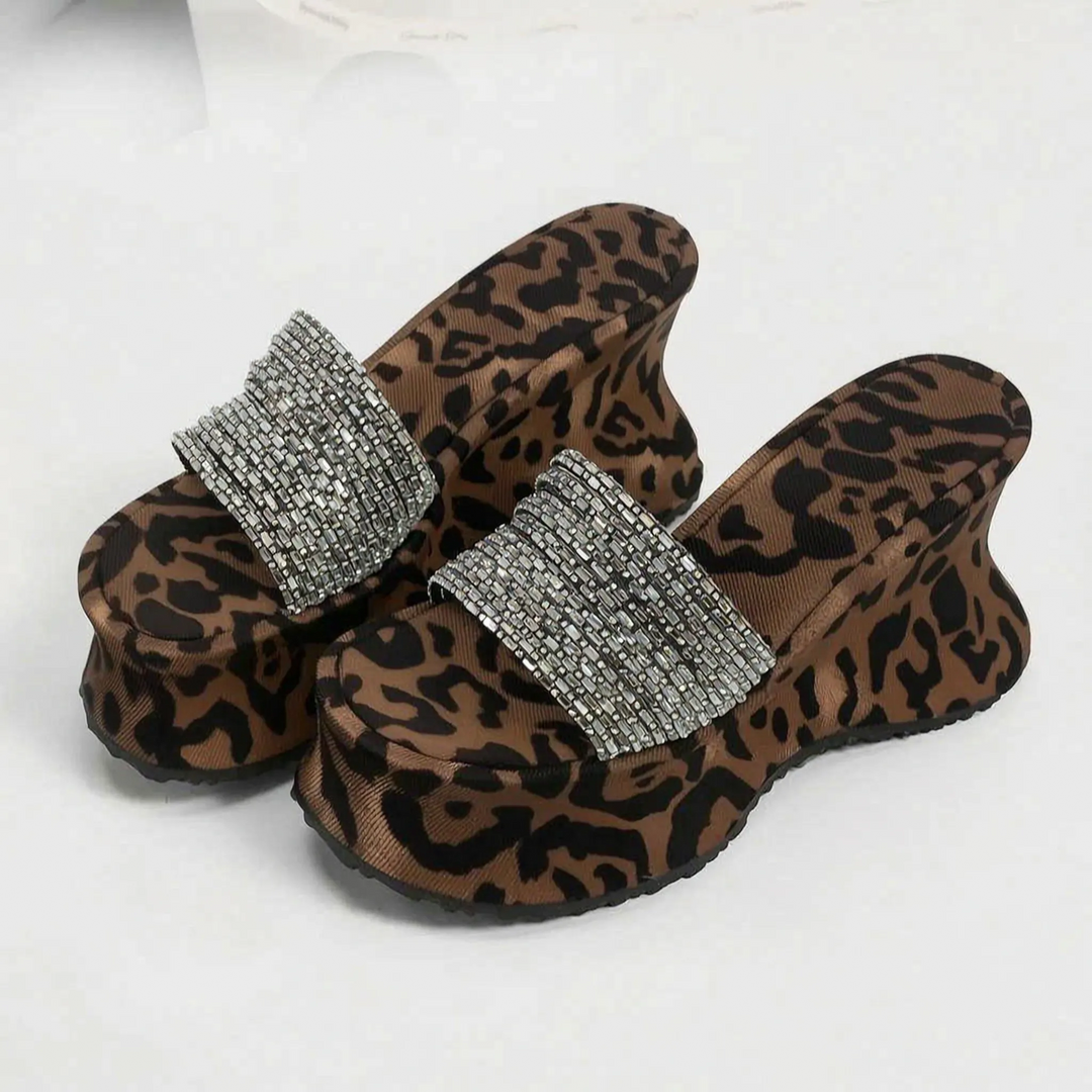 Fashion-forward women's animal print open-toe chunky platform sandals for bold summer style.