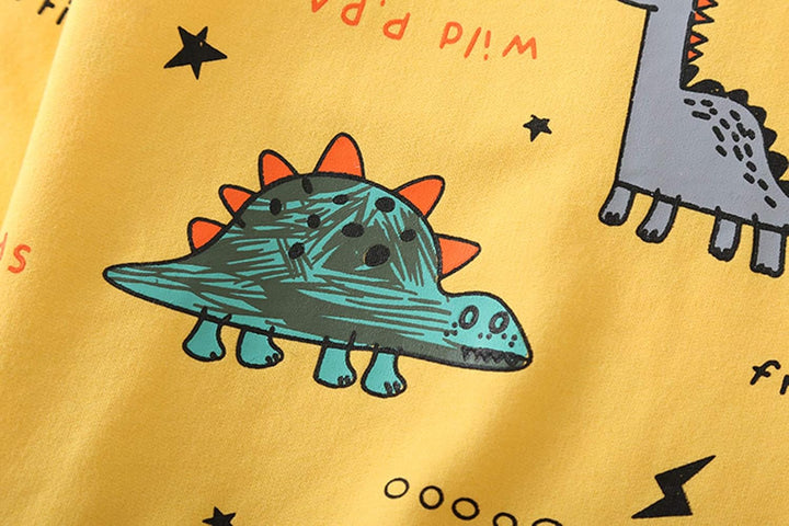 Close-up of a boys' dinosaur print t-shirt from the adventure outfit set, showcasing design.
