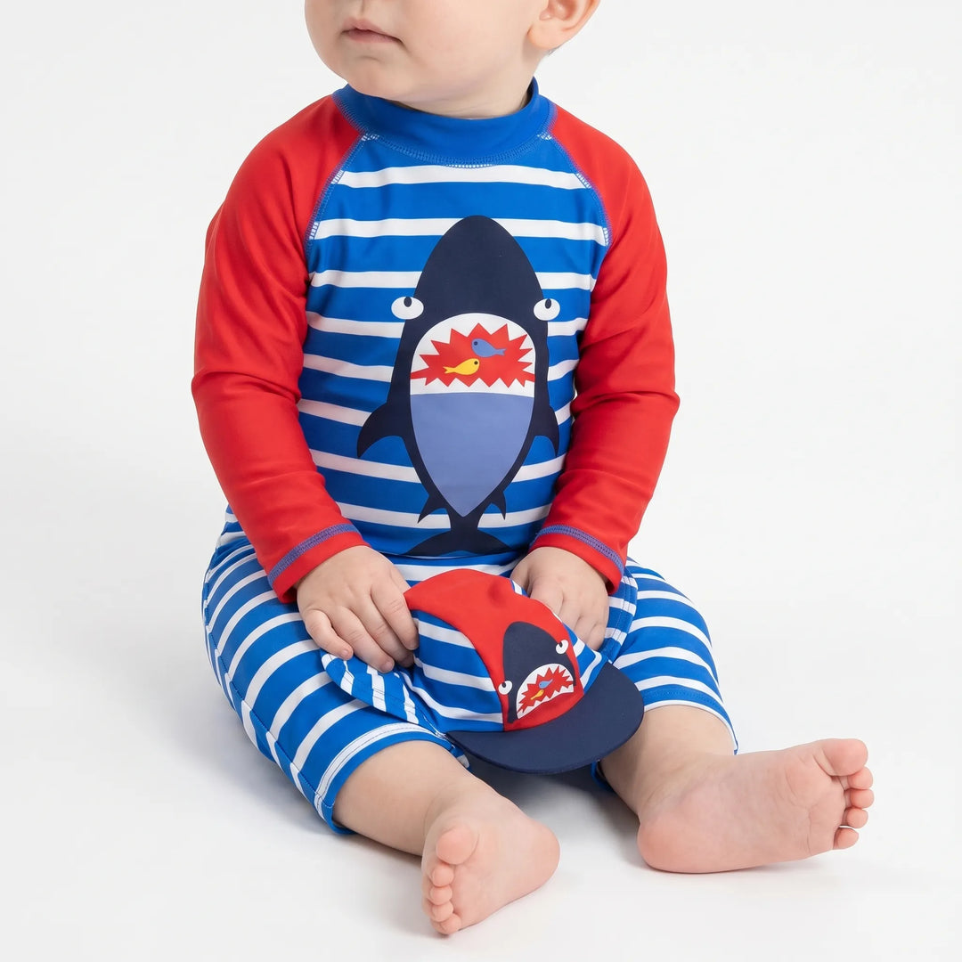 Toddler boys' UPF 50+ rashguard swimwear with fun cartoon print, ideal for beach & pool sun protection.