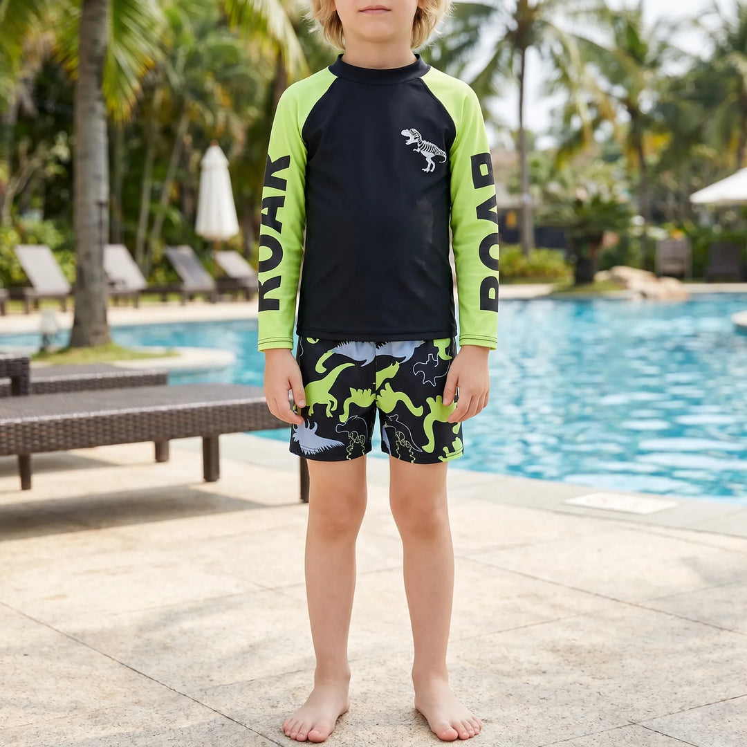 Boys' long sleeve dinosaur swimwear set. Sun protection UPF 50+ two-piece for beach and pool fun.
