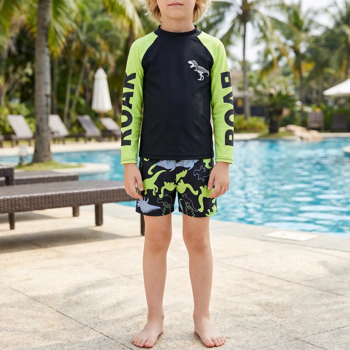 Boys' long sleeve dinosaur swimwear set. Sun protection UPF 50+ two-piece for beach and pool fun.