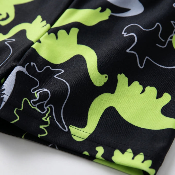 Kids' two-piece dinosaur swimwear. Long sleeve top and swim shorts provide sun protection for active boys.