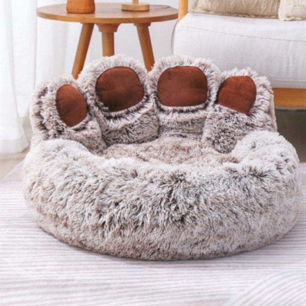 Pink calming dog bed with plush reversible cushion, anti-anxiety features, and machine washable cover.