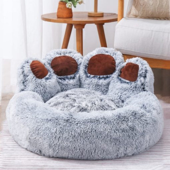 Top view of a cozy pet sofa bed showcasing its anti-anxiety design and comfortable, washable fabric.