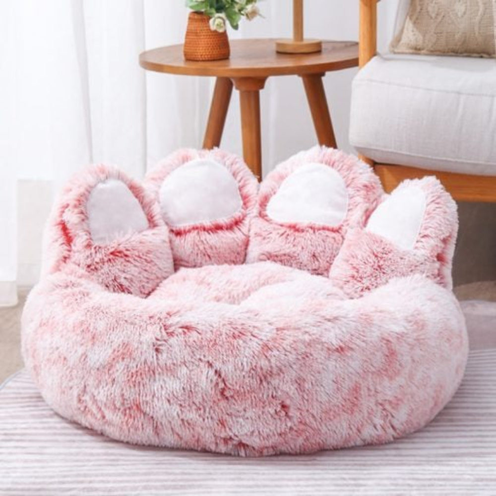 Close-up of the soft texture and supportive rim of a calming pet sofa bed, designed for dog anxiety relief.