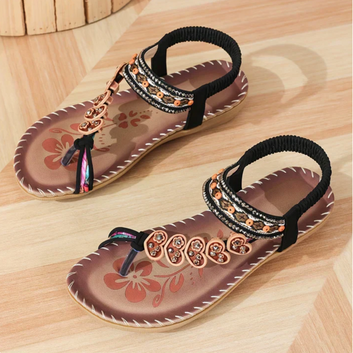 Stylish beige Solara women's beach sandals. Comfortable slip-on footwear, perfect for summer vacations.