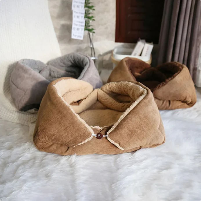 Soft gray cat bed transforming into a warm pet blanket, a cozy accessory for feline comfort.