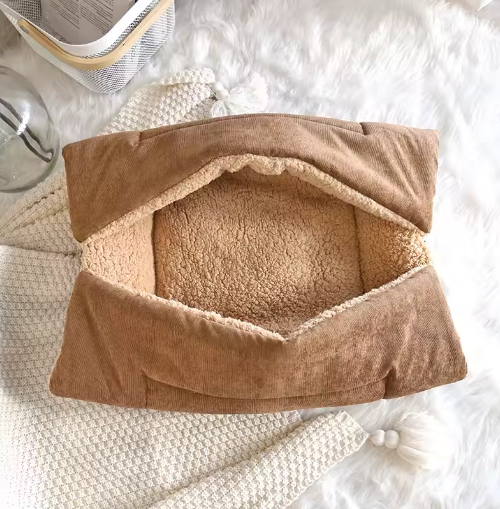 Innovative pet comfort solution: a cozy cat bed that unfolds into a warm, soft blanket.