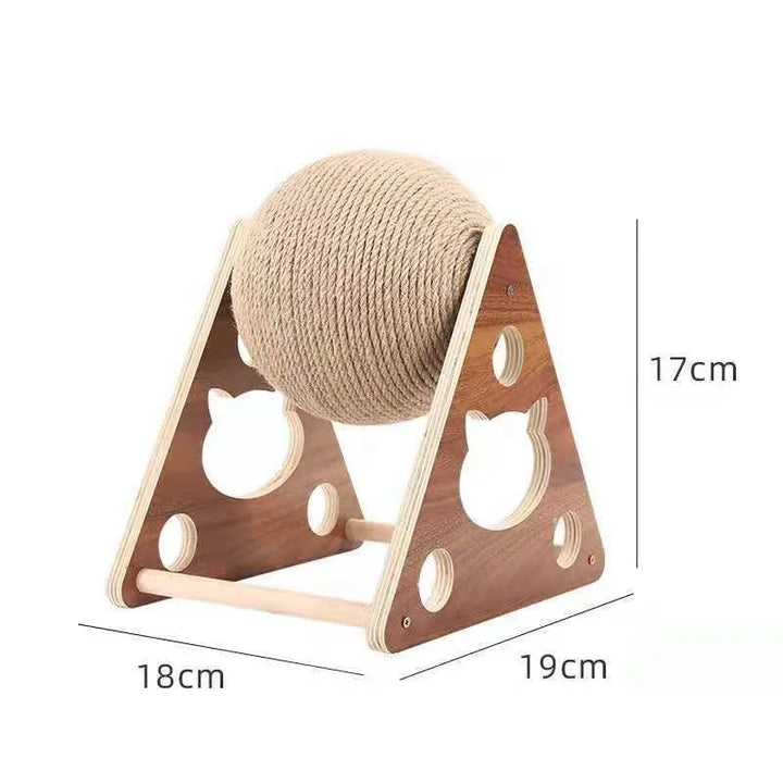 Cute kitten playing with a 360° rotating sisal ball scratching post, wooden base