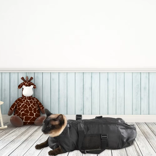 Pet grooming restraint bag, durable and escape-proof, for effective cat care and nail clipping.