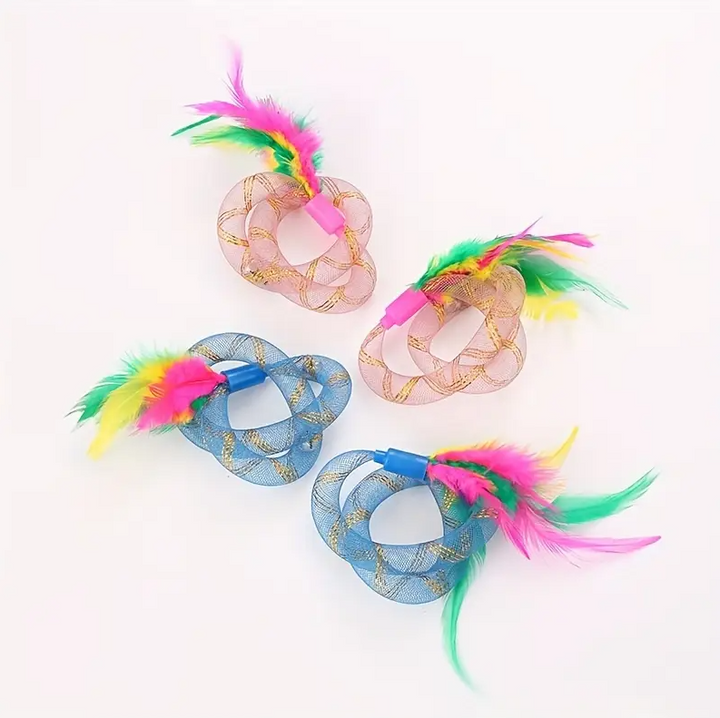 Close-up of a cat shuttlecock feather toy with mesh rings, ideal for pet exercise
