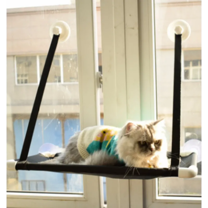Durable cat bed window lounger, perfect for cats to observe surroundings, featuring a sturdy design and suction mounts.