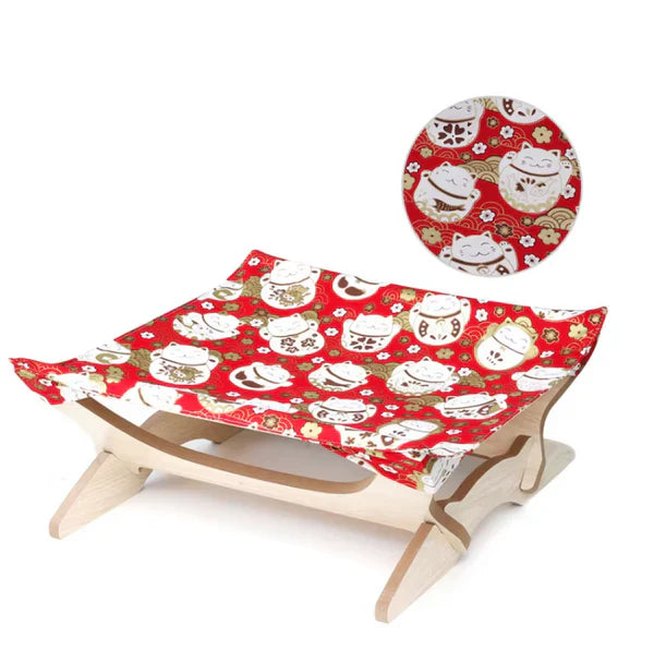 Cat's wooden bed featuring a bright striped cover, a stylish pet furniture piece.