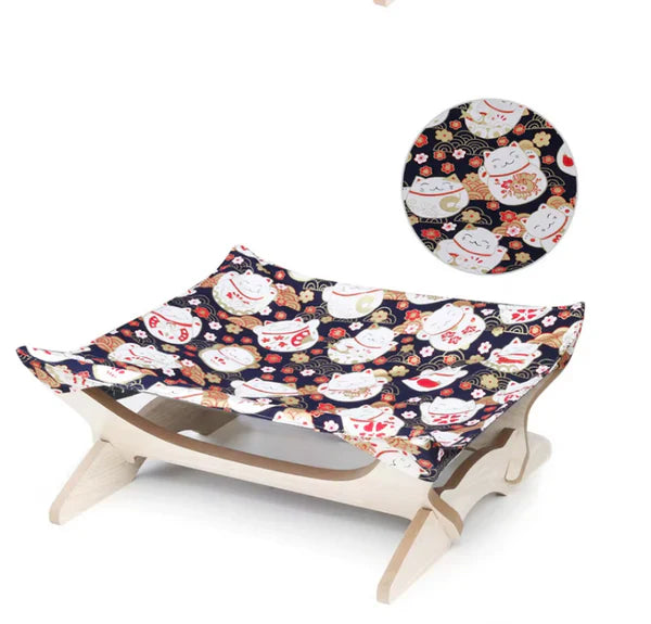Pet lounger: wooden frame with colorful striped cover, ideal for cats.