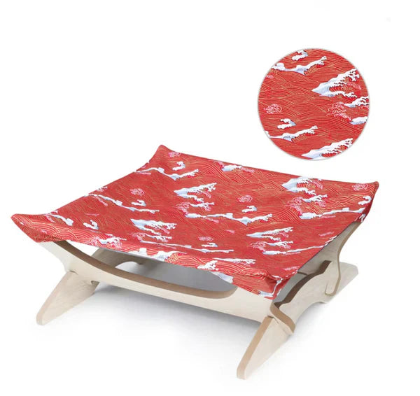 Feline pet furniture: wooden cat bed with an eye-catching striped cover.