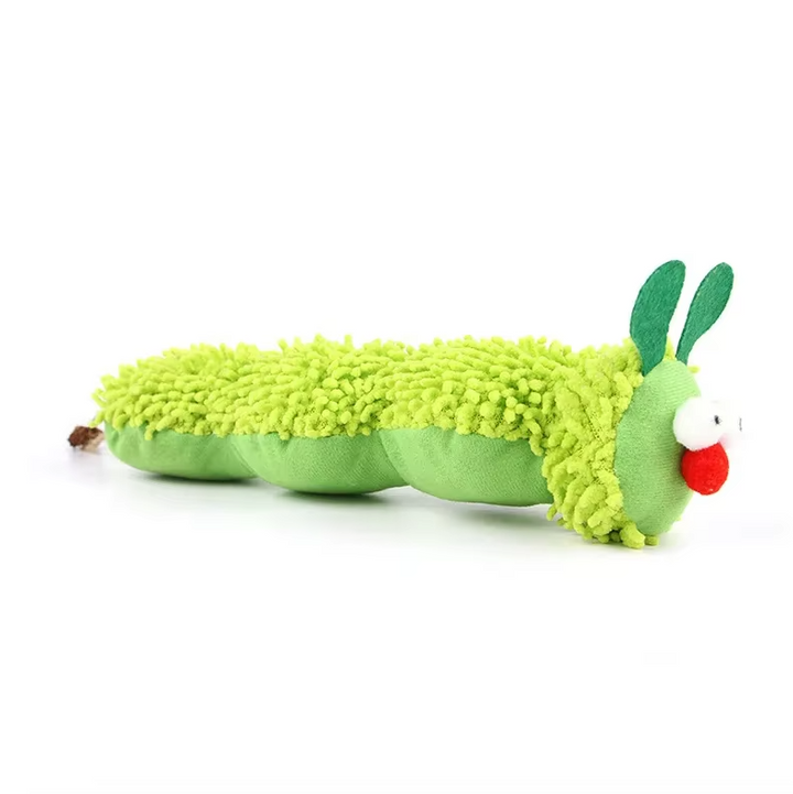 A cat batting at a bright green plush catnip caterpillar toy, demonstrating interactive play value