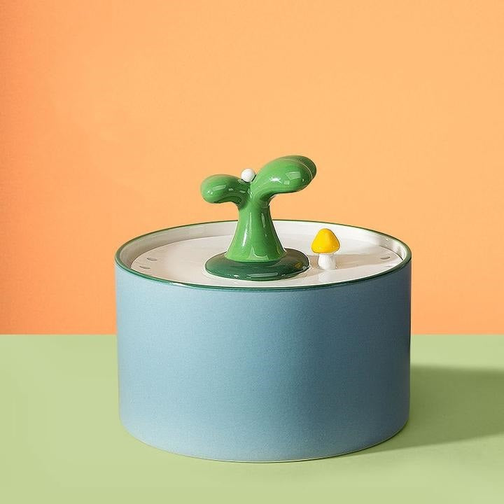 Stylish pet hydration station: ceramic water fountain with efficient double filtration and low-noise pump.