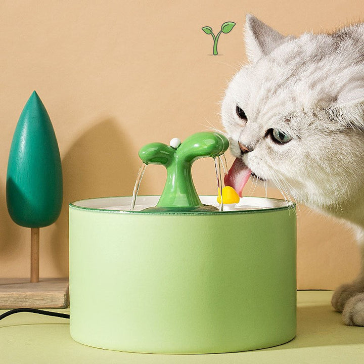 Close-up of the double filtration system in a ceramic pet water fountain, highlighting clean water supply.