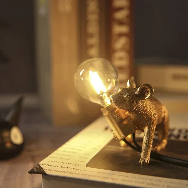 Gold and white mouse lamp, playful desk lighting solution for unique home decor.