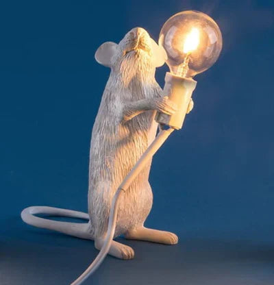 Gold mouse table lamp with white shade, ideal for playful desk lighting and home decor.