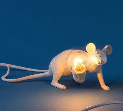 Sleek gold mouse lamp, unique white desk lighting option for modern home decor.