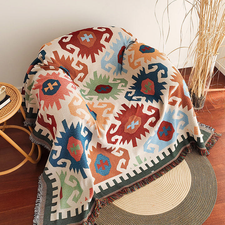 Textured checkerboard design sofa blanket featuring a delicate fringe trim, a cozy living room essential.