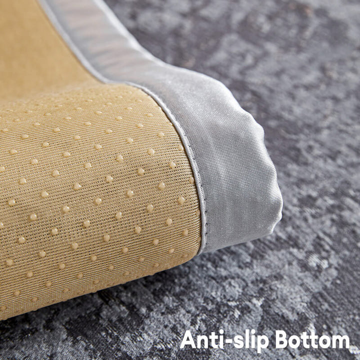 Pet (cat) comfortably resting on a chenille anti-scratch couch cover, pet friendly