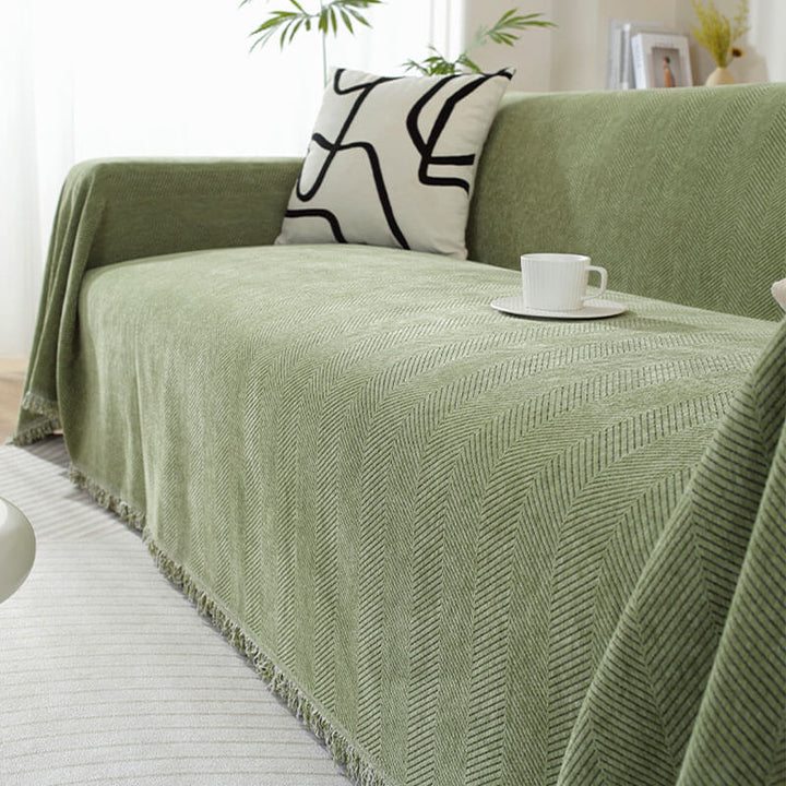 High-quality chenille couch cover showcasing its durable herringbone design and fringe
