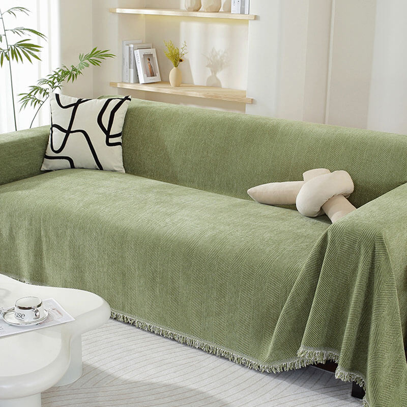 Soft chenille herringbone throw blanket draped over a couch, elegant home decor accent