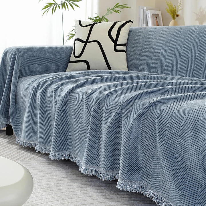 Close-up of chenille fabric with herringbone weave, showing texture of couch cover